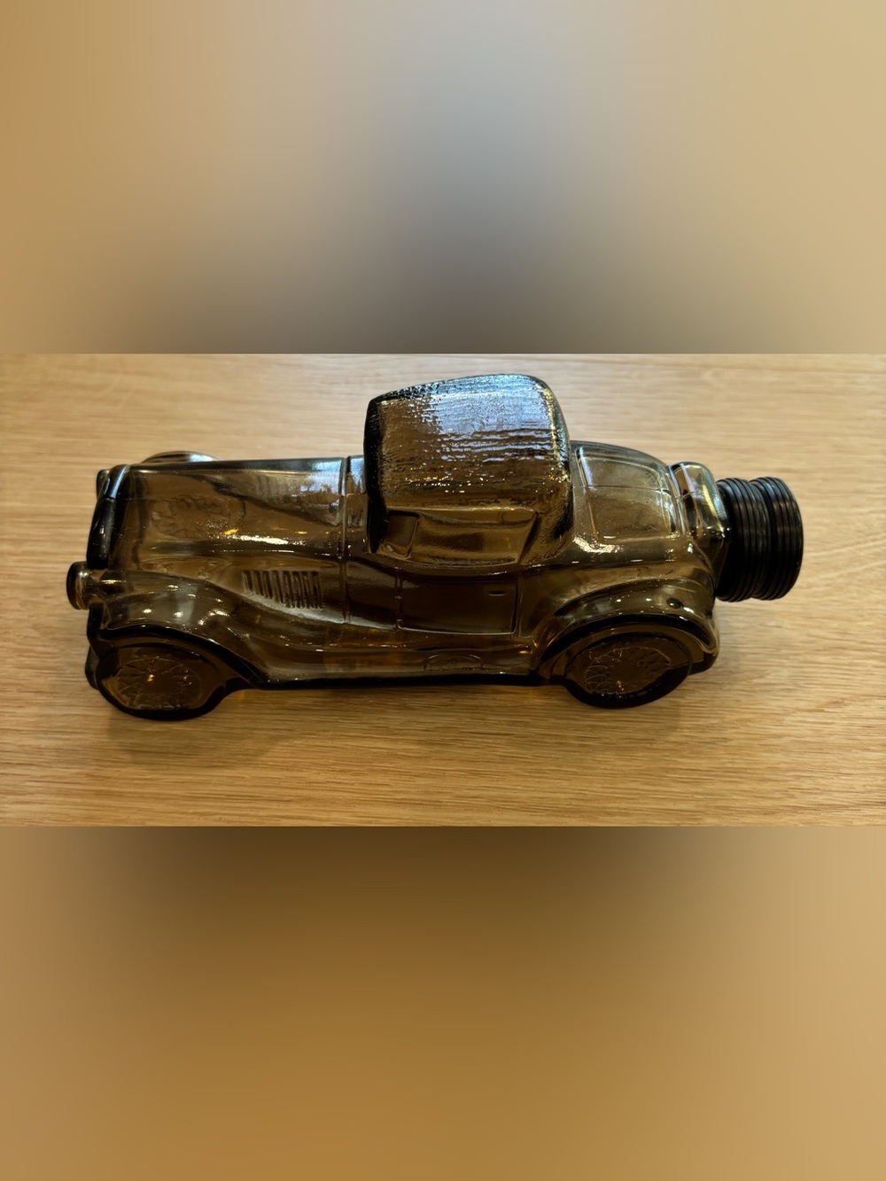 Vintage Avon Sterling Six car bottle made of amber glass